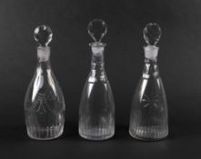 Three small decanters and stoppers, late 18th/early 19th century, two tapering and cut with vertical