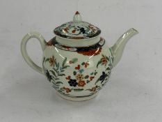 A Worcester teapot and cover, c.1770, painted in an extended Imari palette with flowering plants, th
