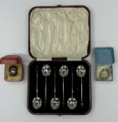 Silver: Set of six silver coffee/cocktail spoons, boxed and two brooches, one a 9ct gold backed mour