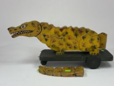 Toys: an early 20th century pull along crocodile, patent application number 5905/19 dating it to 191