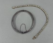 Jewellery: a 9ct gold and diamond tennis style bracelet, each of the 39 diamonds within an individua