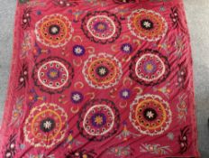 A large Suzani panel, 20th century Uzbek, made of three cotton panels sewn together and embroidered 