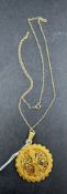 Jewellery: Circular pendant, 32mm in diameter, attached to a 9ct gold chain, weight of pendant 10g, 