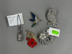 Jewellery: a 9ct gold mounted cameo brooch with safety chain, a pair of cameo earrings, a white meta
