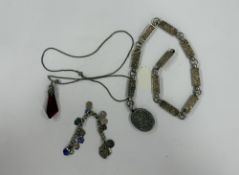 Jewellery: a white metal charm bracelet marked 'SIL', heart shaped clasp, suspended with a number of