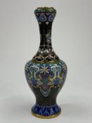A Chinese cloisonné vase, 20th century, the baluster body decorated with formal lappets on a key fre