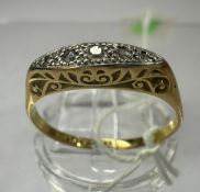 Jewellery: a yellow and white metal ring, marked 18ct and platinum, five small diamonds within a mar