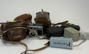 Cameras: a Voigtlander Vito C, a Braun Paxette and a Yashica Mat TLR camera, all cased, together wit