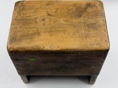 Furniture: a primitive heavy built rustic stool of indeterminate age, probably 19th century, 36cm hi
