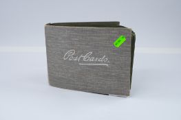 Postcards: a small album of early 20th century Christmas and birthday cards of postcard form.