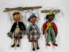Three Pelham Puppets, mid century, two of Scottish characters, one of a black minstrel, contained in