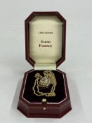 Jewellery: Sarah Faberge- a limited edition diamond set gold plated silver egg on yellow metal chain