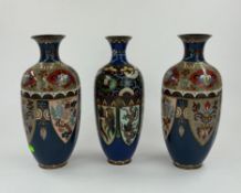 A pair of early 20th century Japanese cloisonne vases of quatrefoil form, decorated with flowers and