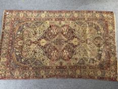 Rugs: a late 19th/ early 20th century North West Persian hand knotted rug, decorated in muted colour