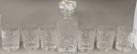 Glass: a set of six Baccarat cut glass tumblers and a decanter and stopper, cut with a stylised flow