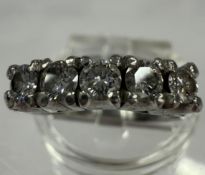 Jewellery: Platinum half hoop ring set with five brilliant-cut diamonds, estimated weight of (5) 0.5