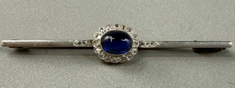 Jewellery: Yellow and white metal bar brooch, length 51mm, at the centre is a cluster set with an ov