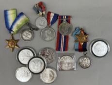 Coins: three World War 2 medals, two temperance medals, other medals, and seven 1oz fine silver coin