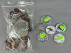 Coins: an Australian 2010 kookaburra one ounce pure silver dollar coin; a similar koala coin; a 2010
