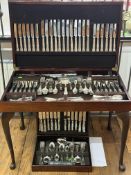Silver Plate: a mid century leather topped cutlery table, cabriole legs, the lid opening to reveal a
