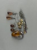 Jewellery: Two pairs of silver and amber drop earrings, an oval amber brooch, an enamel fish pendant