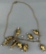 Jewellery: Yellow metal trace link chain marked 15ct, with nine graduated rodent drops, each with a 