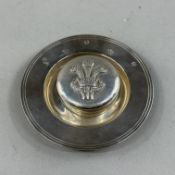 Silver: an Armada dish by Carrs, Sheffield millennium hallmarked, 10cm diameter, together with a rou