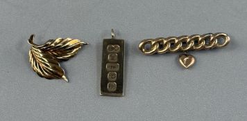 Jewellery: a 9ct gold ingot pendant, Sheffield 1978, 7.5g; a 9ct gold two leaf brooch, 1.8g and a ch