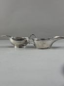 Silver: a white metal Colonial pap or sauce boat, with ring handle and elongated spout, unmarked but