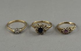 Jewellery: a 9ct yellow gold ring set a central sapphire within a border of white stones, UK size P;