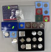 Coins: a boxed 1986 Liberty dollar, a JF Kennedy coin set, 12 cased crowns, a 1922 silver dollar, an