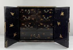 Asian Art: a Japanese black lacquer table cabinet or kodansu, Meiji period, gilded bird and bamboo d