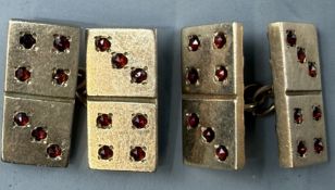 Jewellery: a pair of 9ct yellow gold cufflinks, each end modelled as a domino set with facet cut gar