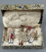 Toys: an early 20th century articulated bisque doll, painted shoes and socks with original dress, 8c