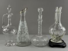 Four glass pouring vessels, 19th century and later, one a condiment or liqueur decanter with four co