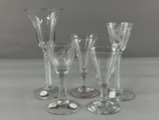Five English wine glasses, 2nd half 18th century, one with a bell bowl over an opaque twist stem, an