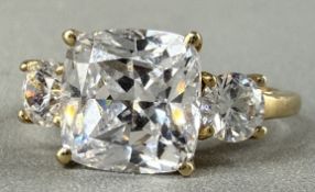 Jewellery: a yellow metal three white stone ring, marked 10k and testing as gold, UK size K, 2.6g.