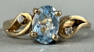 Jewellery: a yellow metal three stone ring, marked 10k and testing as gold, a central Cambodian zirc