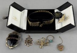 Jewellery: an early 20th century 9ct gold pendant, a central stone within a pierced framework, 2.3g;