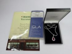 Jewellery: White metal Riviere necklet with a pear-shaped drop pendant comprised of two outer rows o