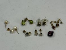 Jewellery: a pair of peridot and 9ct gold earrings for pierced ears, a pair of garnet earrings, smok