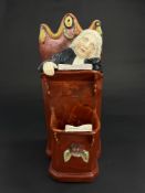A Staffordshire pearlware figure group of the Vicar and Moses, c.1820, the vicar sleeping in the pul