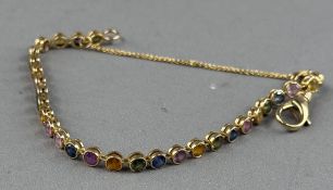 Jewellery: Yellow metal line bracelet, rub over set with thirty-one multicoloured gemstones, length 