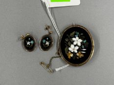 Jewellery: an Italian pietra dura oval brooch, mounted in an Etruscan style yellow metal mount, the 