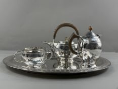 Silver: a Liberty & Co three piece teaset comprising tea kettle, sugar bowl and cream jug, each 
