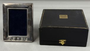 Silver: a pair of silver mounted rosewood pepper mills or grinders by M C Hersey & Son Ltd, Lond