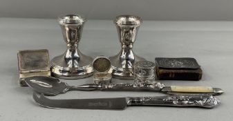 Silver: a pair of filled silver dwarf candlesticks, Birmingham 1993; a miniature book of Common Pray