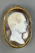 Jewellery: an unmarked yellow metal mounted shell cameo depicting a seated gentleman, repairs to the
