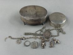 Silver: an oval dressing table box, Birmingham 1924, standing upon four cabriole legs with the name 