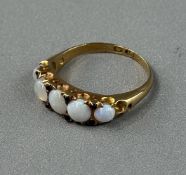 Jewellery: Ring yellow metal half hoop set with five cabochon-cut opals, estimated weight of (5) 1.2